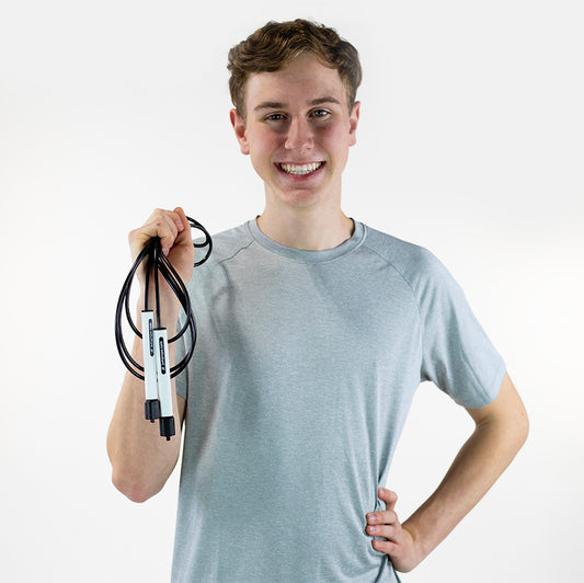Man holding a Freestyle Rope from jumprope.com while smiling