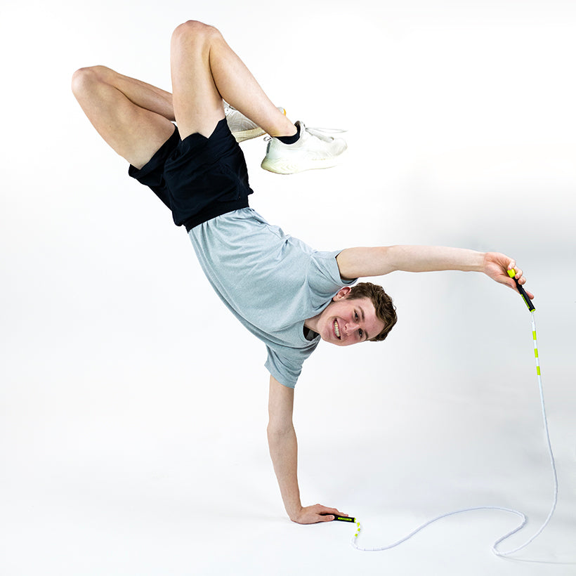 Man performing a jump rope trick with a Beaded Rope 
